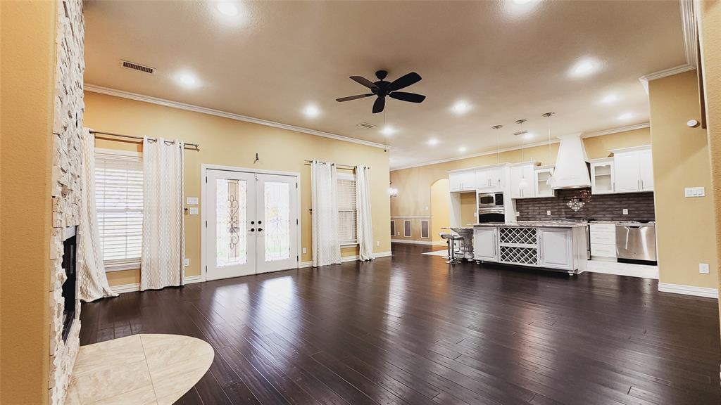 511 East Cook Street, Unit 1 Josephine, TX 75173 - Photo 8 of 29 a view of kitchen with furniture and wooden floor
