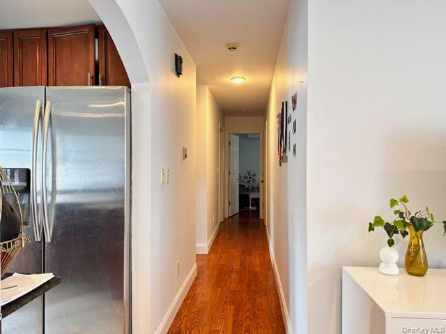133 Railroad Avenue, Unit 2 Syosset, NY 11791 - Photo 4 of 11 a view of a hallway with wooden floor