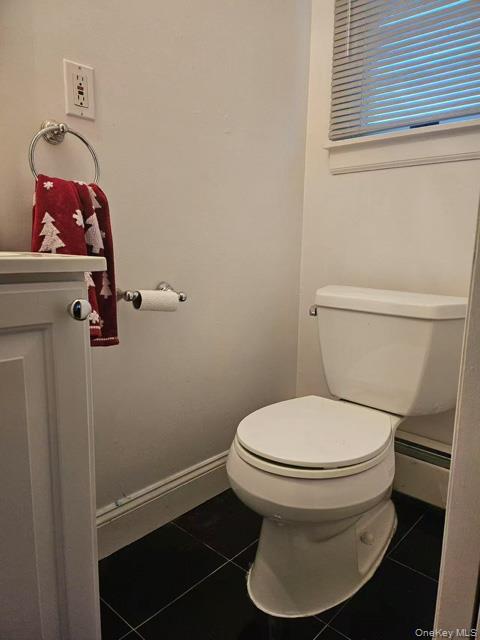 133 Railroad Avenue, Unit 2 Syosset, NY 11791 - Photo 6 of 11 a white toilet sitting next to a window