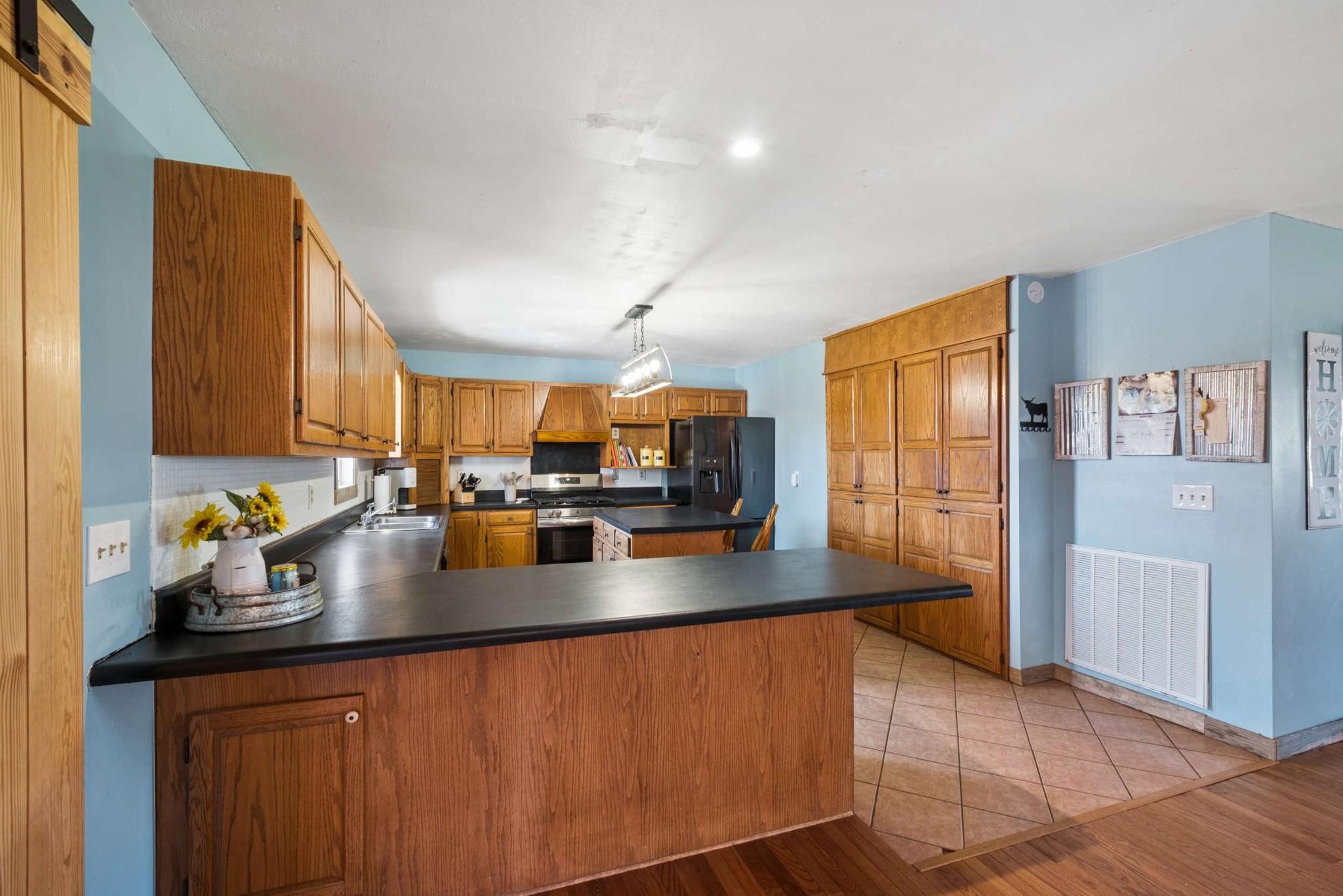 324 Laster-Holman Lane Decherd, TN 37324 - Photo 11 of 60 a kitchen with a sink a counter top space and cabinets