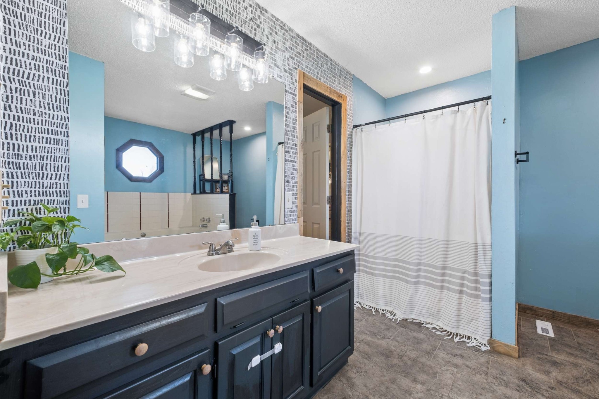 324 Laster-Holman Lane Decherd, TN 37324 - Photo 19 of 60 a bathroom with a sink a vanity and a mirror