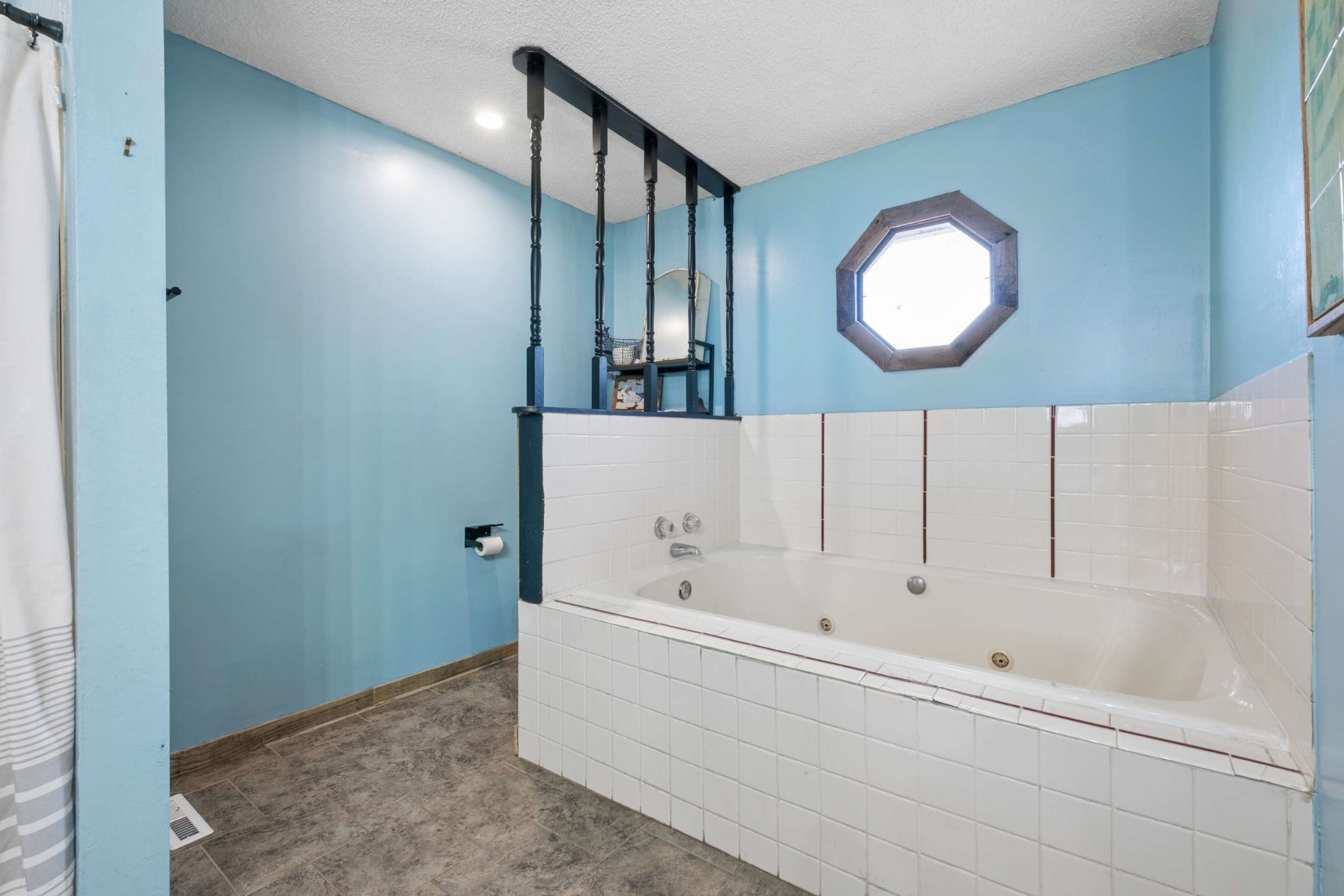 324 Laster-Holman Lane Decherd, TN 37324 - Photo 20 of 60 a bathroom with a bathtub and a mirror
