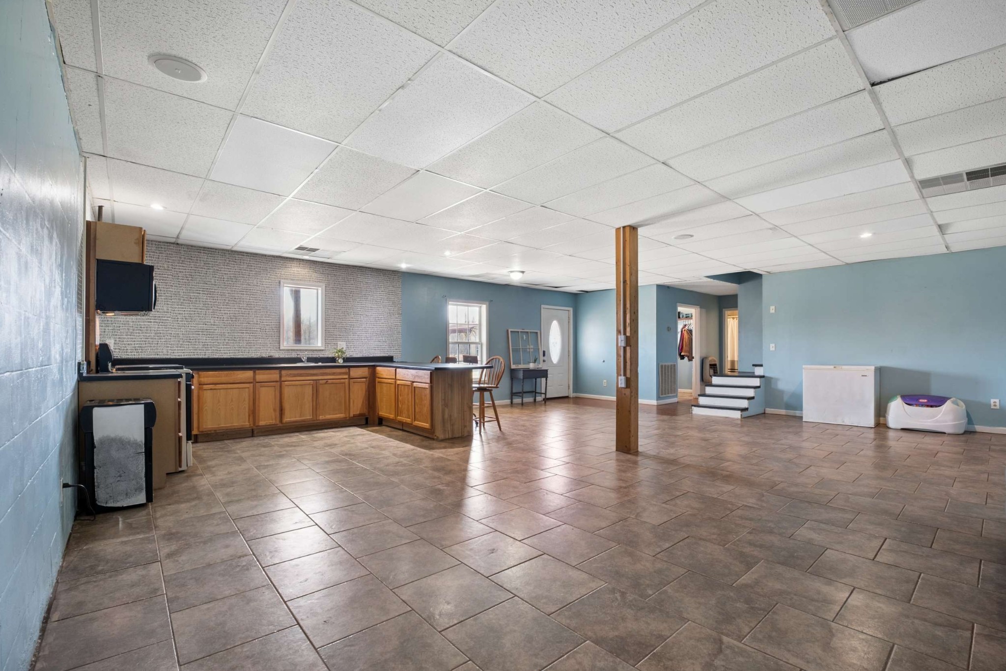 324 Laster-Holman Lane Decherd, TN 37324 - Photo 25 of 60 a view of an empty room with kitchen and window