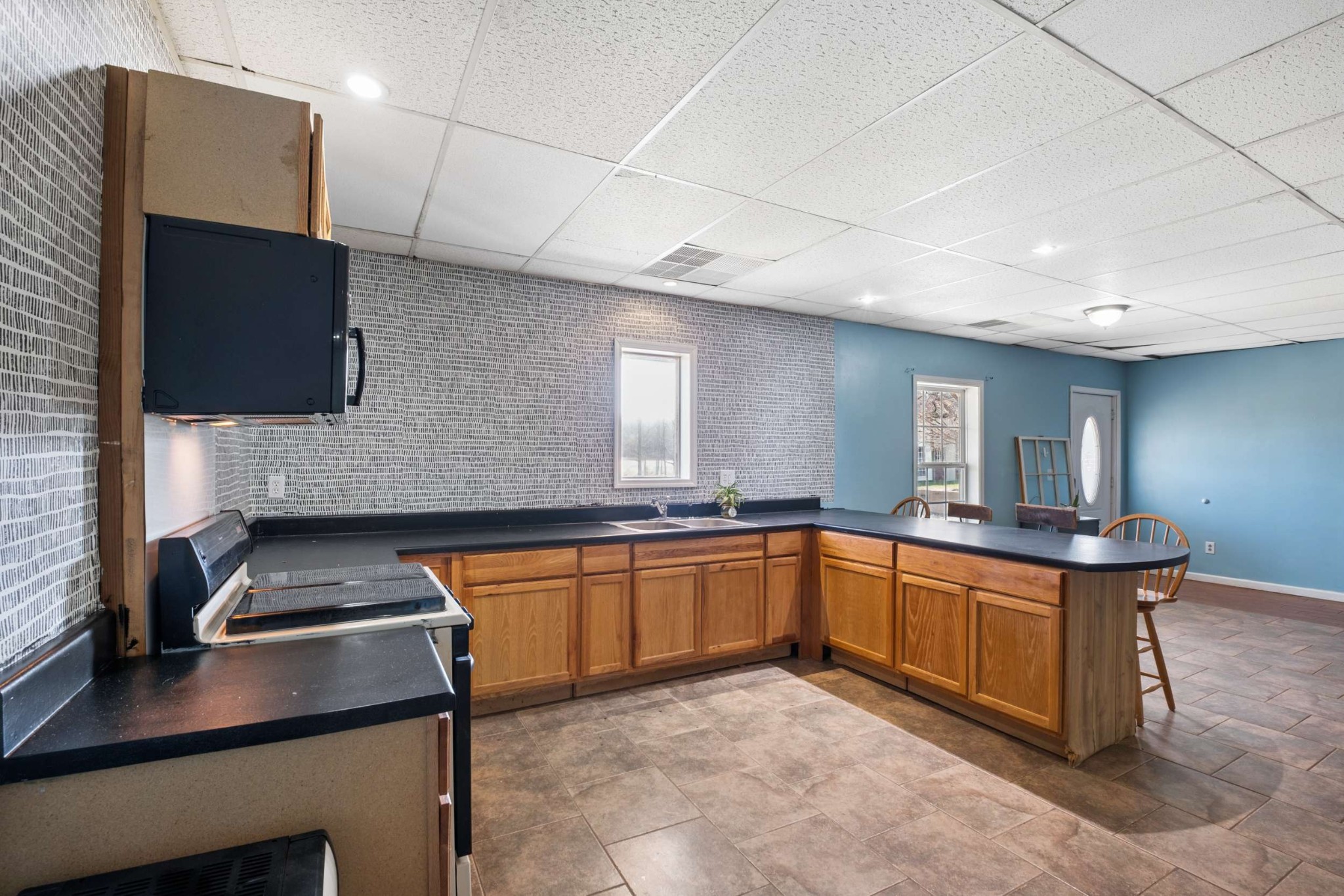 324 Laster-Holman Lane Decherd, TN 37324 - Photo 26 of 60 a kitchen with stainless steel appliances granite countertop a sink and stove