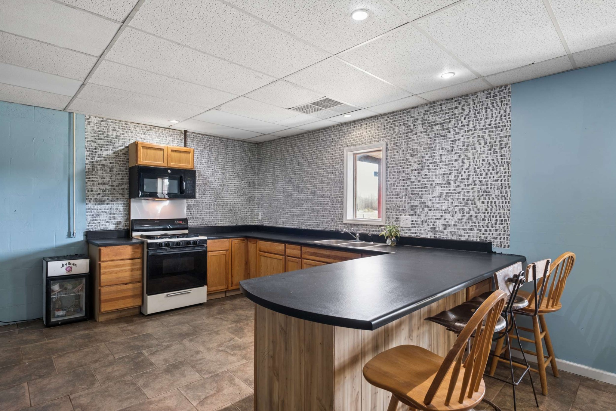 324 Laster-Holman Lane Decherd, TN 37324 - Photo 27 of 60 a kitchen with stainless steel appliances granite countertop a stove a sink and a microwave