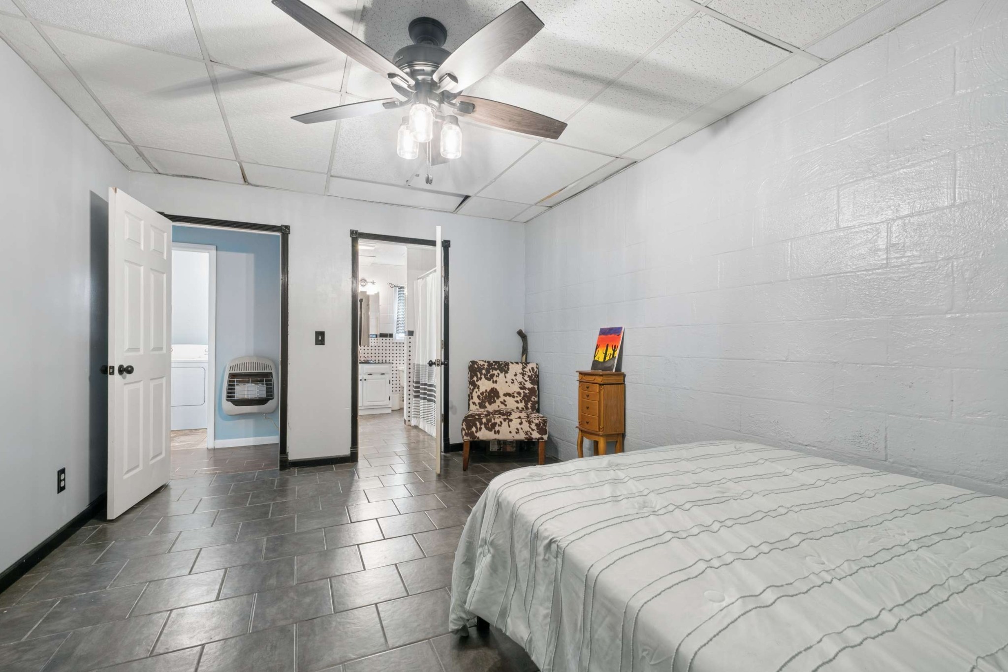 324 Laster-Holman Lane Decherd, TN 37324 - Photo 30 of 60 a bedroom with a bed and a chandelier