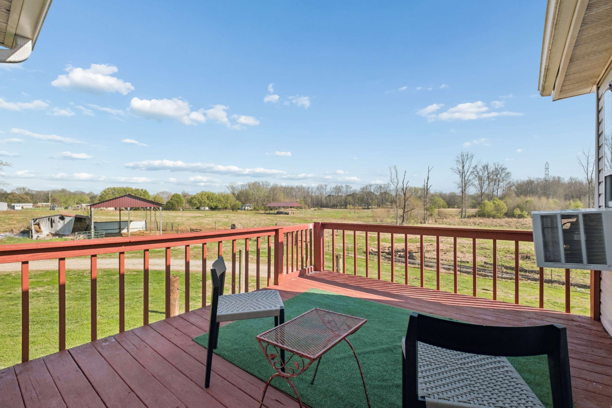 324 Laster-Holman Lane Decherd, TN 37324 - Photo 35 of 60 a view of a balcony with chairs and wooden floor