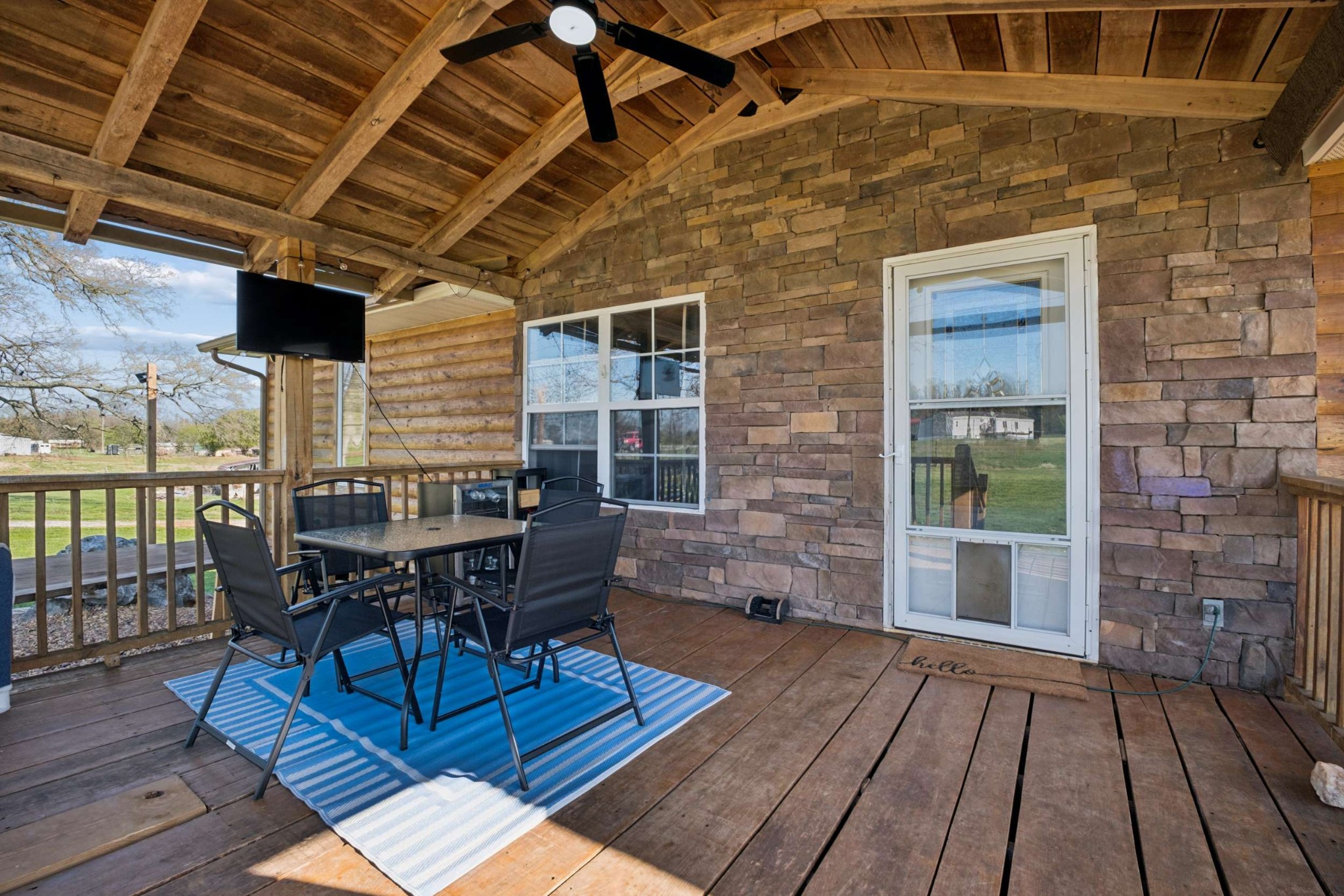 324 Laster-Holman Lane Decherd, TN 37324 - Photo 5 of 60 a patio with glass table and chairs