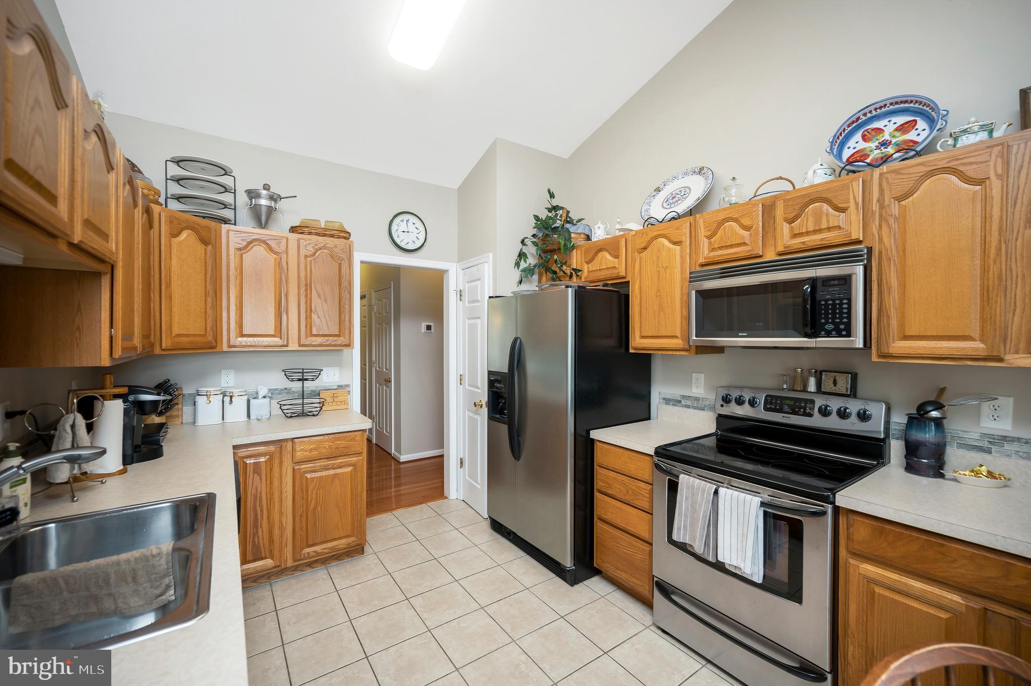 626 Cornwallis Avenue Locust Grove, VA 22508 - Photo 16 of 85 a kitchen with a sink cabinets and stainless steel appliances
