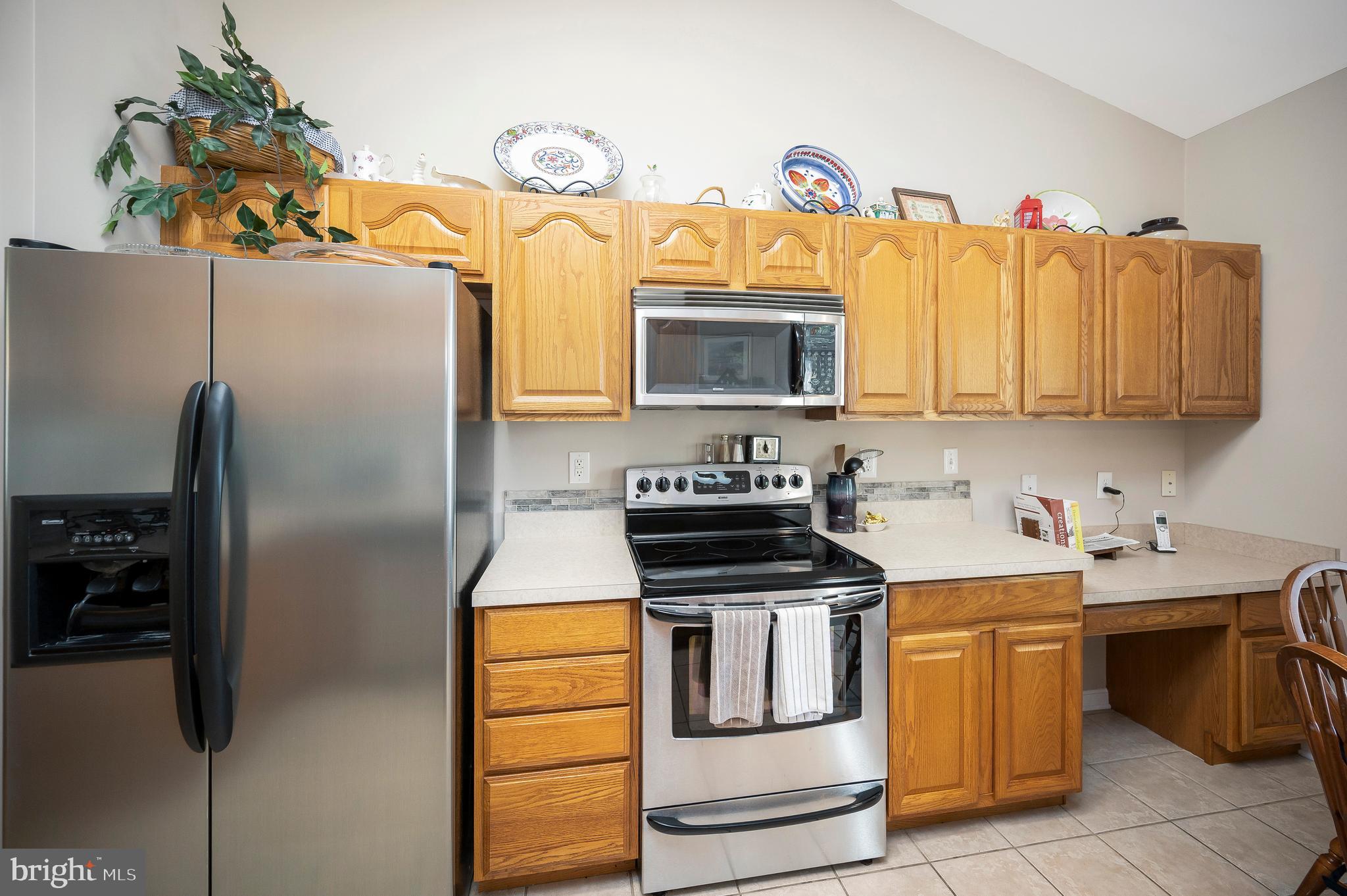 626 Cornwallis Avenue Locust Grove, VA 22508 - Photo 18 of 85 a kitchen with stainless steel appliances granite countertop a stove a refrigerator and a microwave