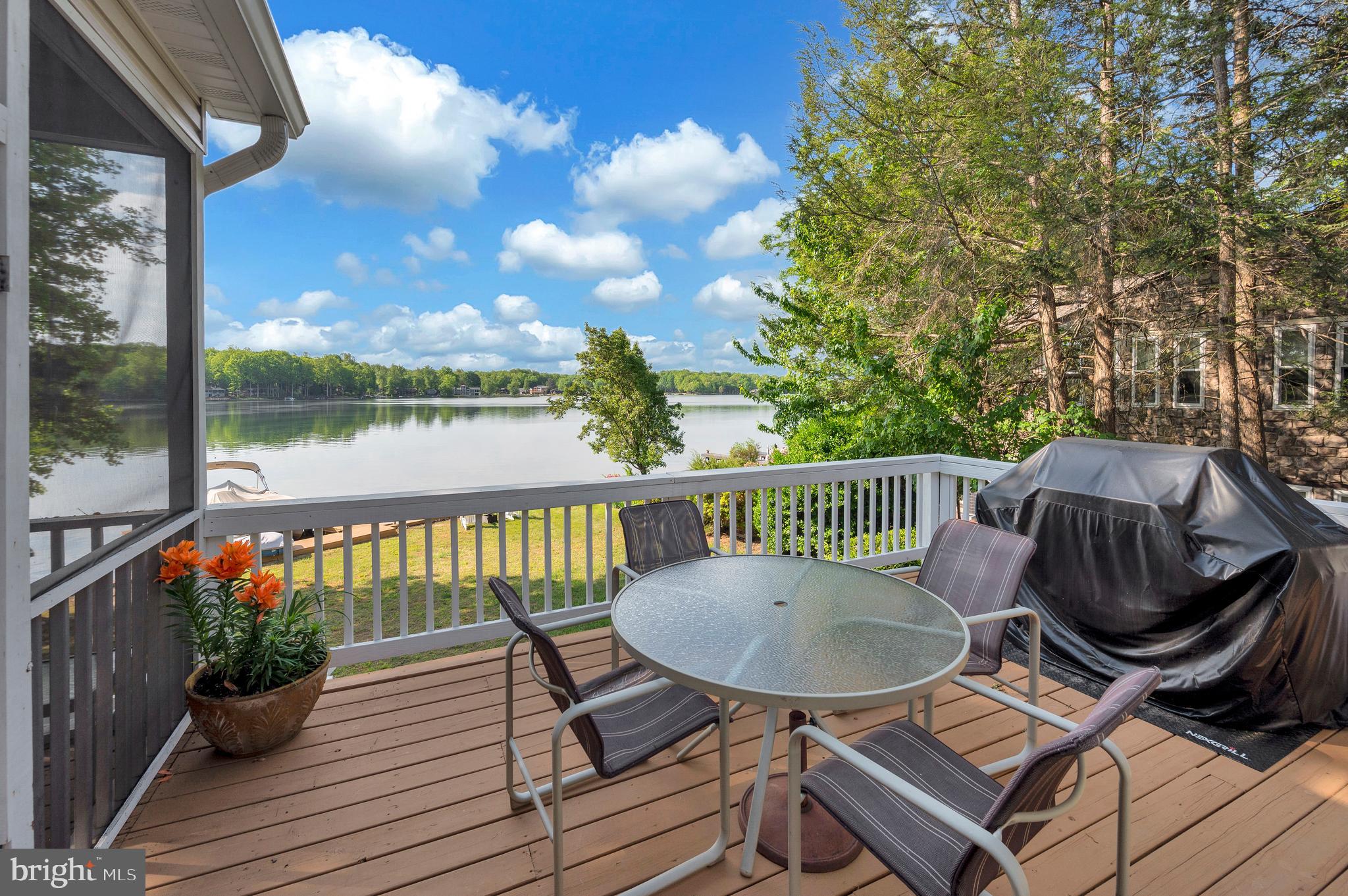 626 Cornwallis Avenue Locust Grove, VA 22508 - Photo 26 of 85 a view of a chairs and table on the wooden deck