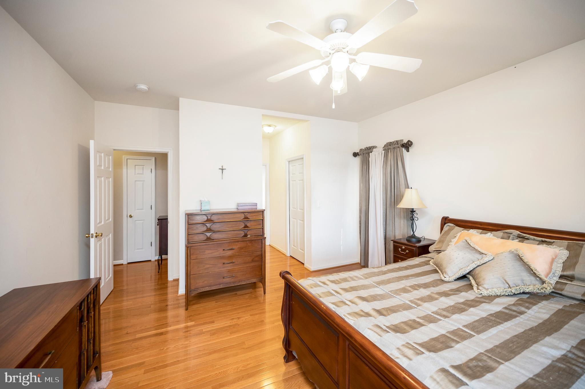 626 Cornwallis Avenue Locust Grove, VA 22508 - Photo 27 of 85 a bedroom with a bed and a chandelier