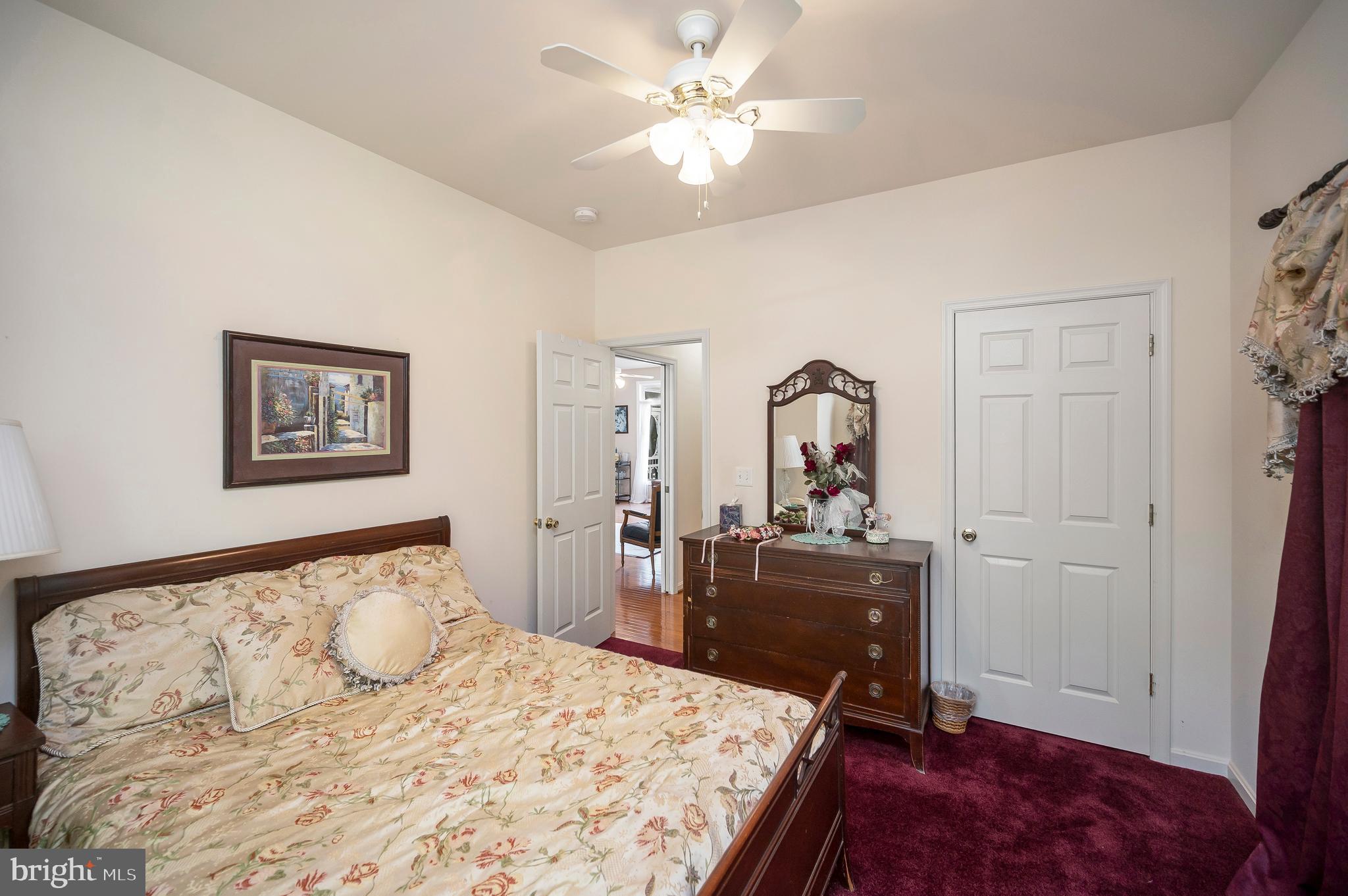 626 Cornwallis Avenue Locust Grove, VA 22508 - Photo 32 of 85 a bedroom with a bed and a dresser with mirror
