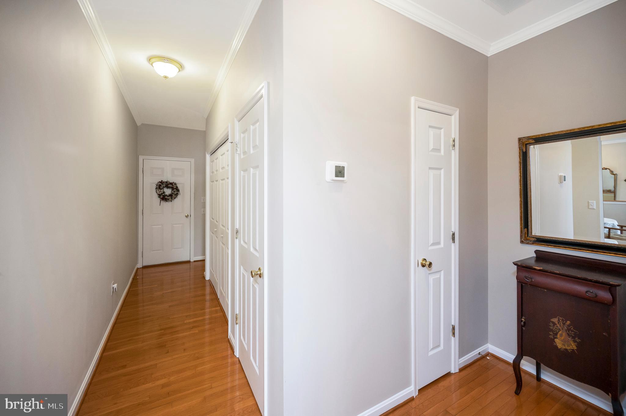 626 Cornwallis Avenue Locust Grove, VA 22508 - Photo 37 of 85 a view of a hallway with a door and wooden floor