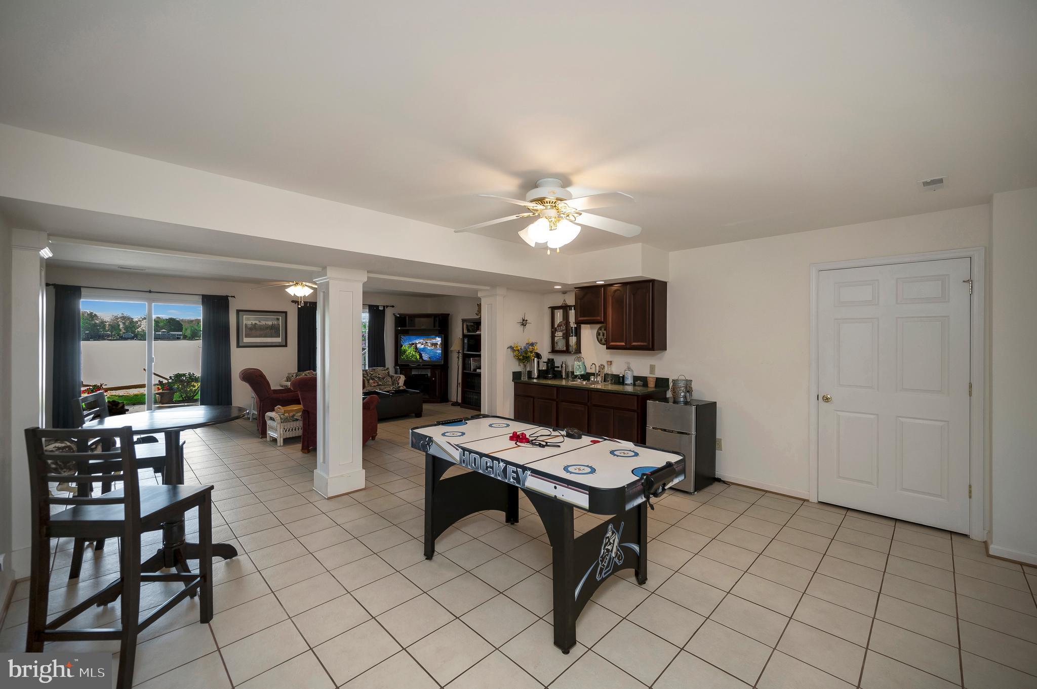 626 Cornwallis Avenue Locust Grove, VA 22508 - Photo 40 of 85 a living room with furniture and a flat screen tv