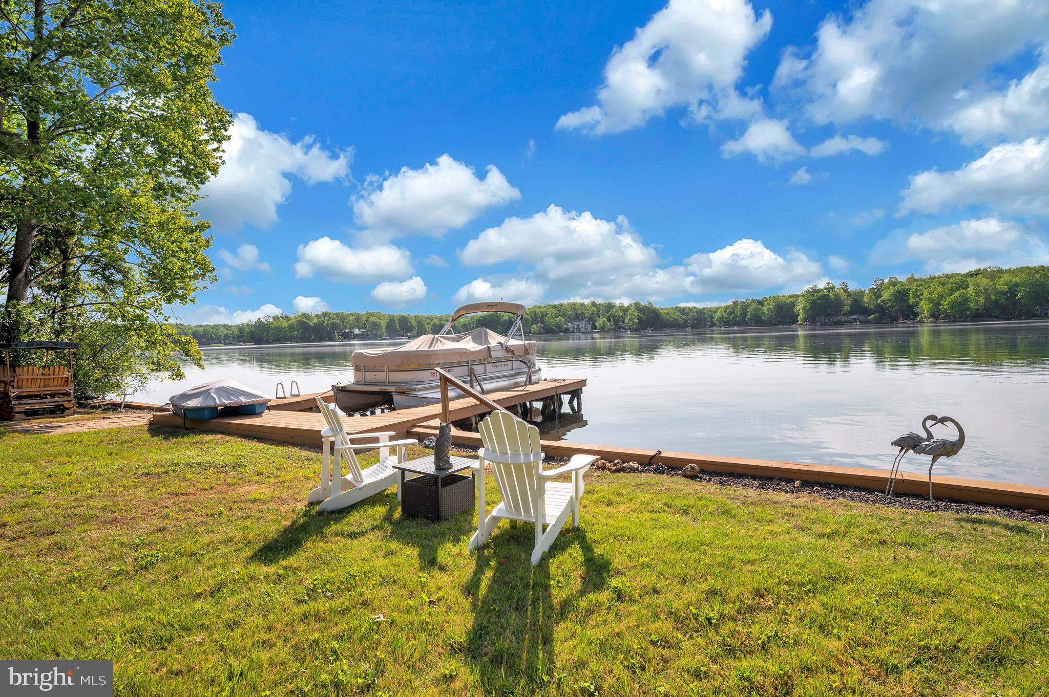 626 Cornwallis Avenue Locust Grove, VA 22508 - Photo 60 of 85 a view of a lake with houses in the back