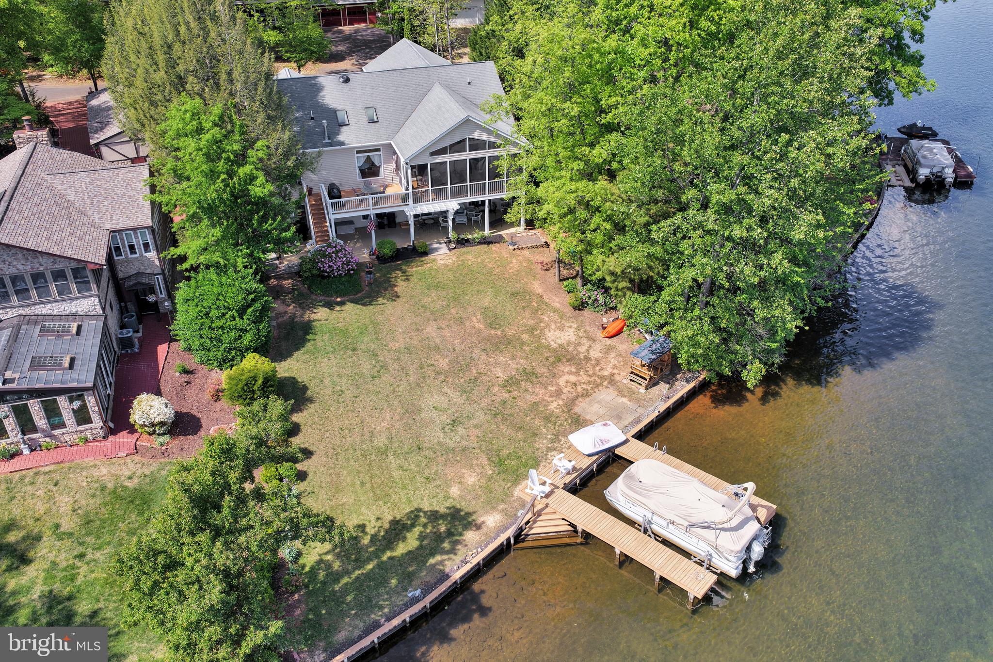 626 Cornwallis Avenue Locust Grove, VA 22508 - Photo 67 of 85 an aerial view of a house with a yard and lake view
