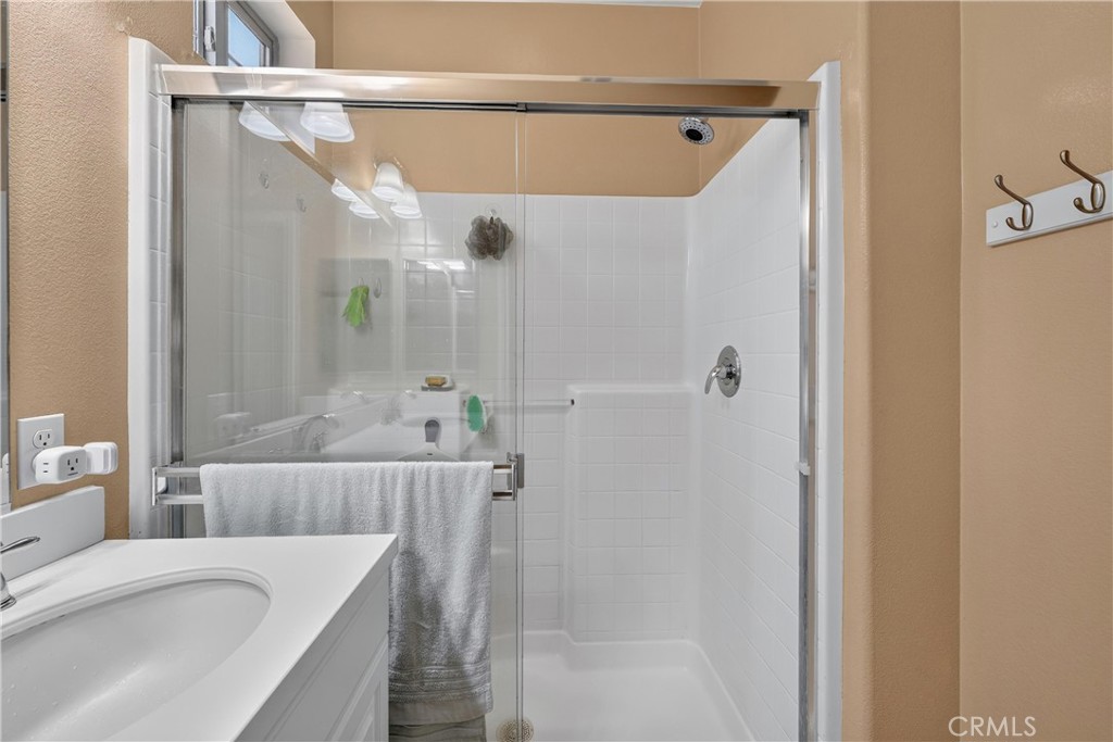 849 The Promenade, Unit D Azusa, CA 91702 - Photo 27 of 37 a bath room with a shower and a bath tub