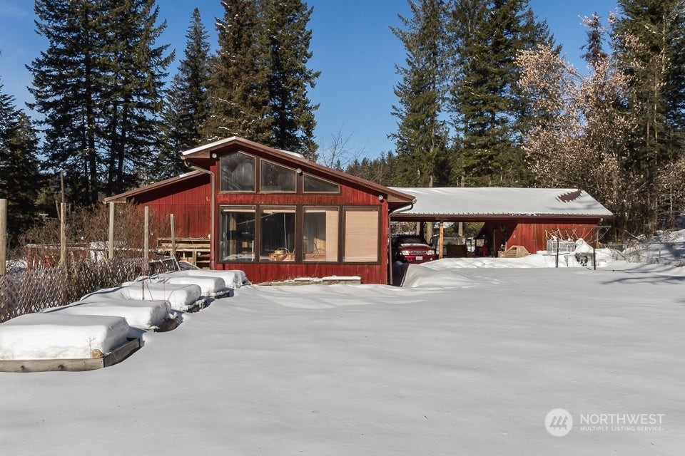 1144 State Rte 20 Colville, WA 99114 - Photo 2 of 38 a front view of a house with yard and parking