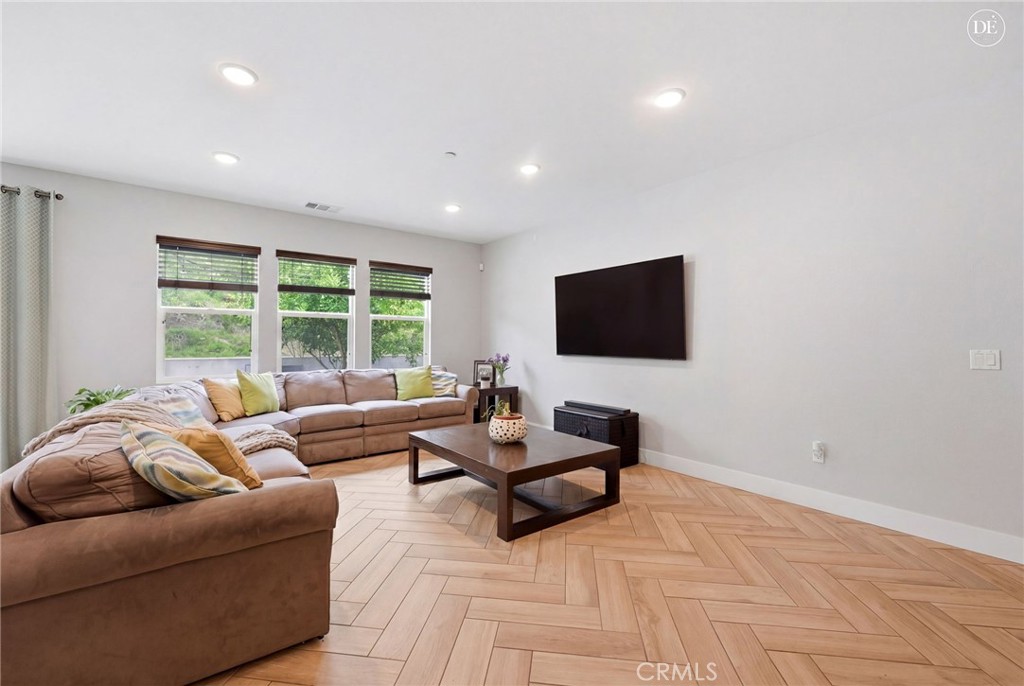 20948 Center Street Riverside, CA 92507 - Photo 20 of 92 a living room with furniture and a flat screen tv