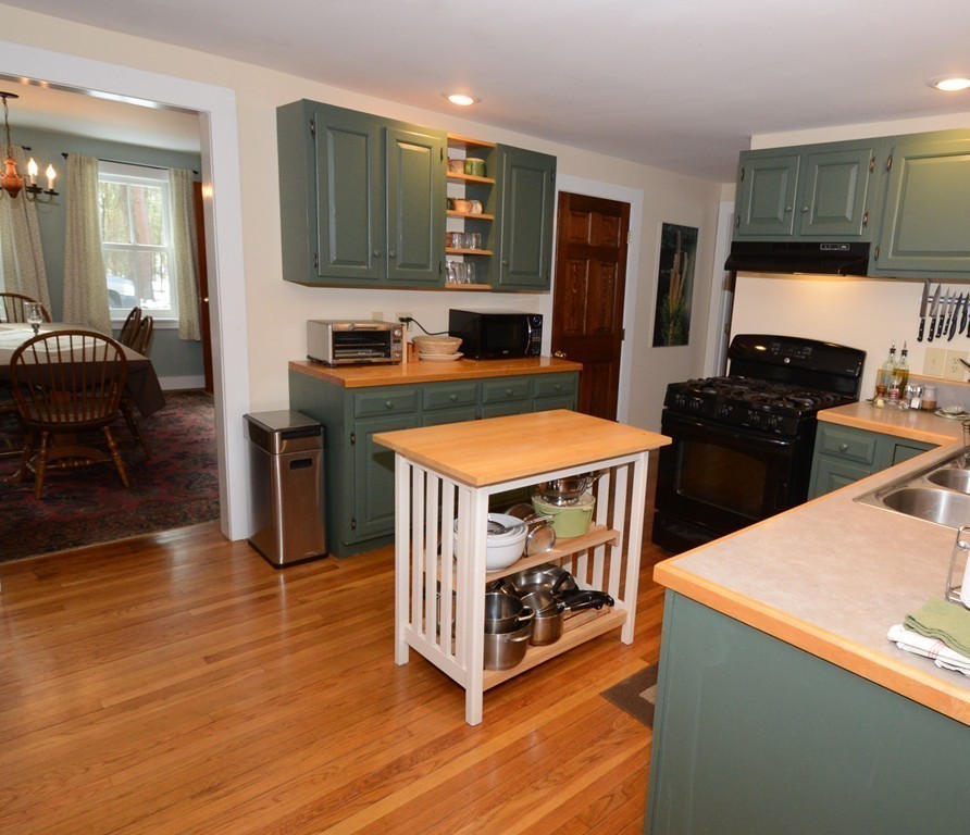16 Juggler Meadow Road Leverett, MA 01054 - Photo 12 of 29 a kitchen with stainless steel appliances granite countertop a stove top oven a sink a counter space and cabinets