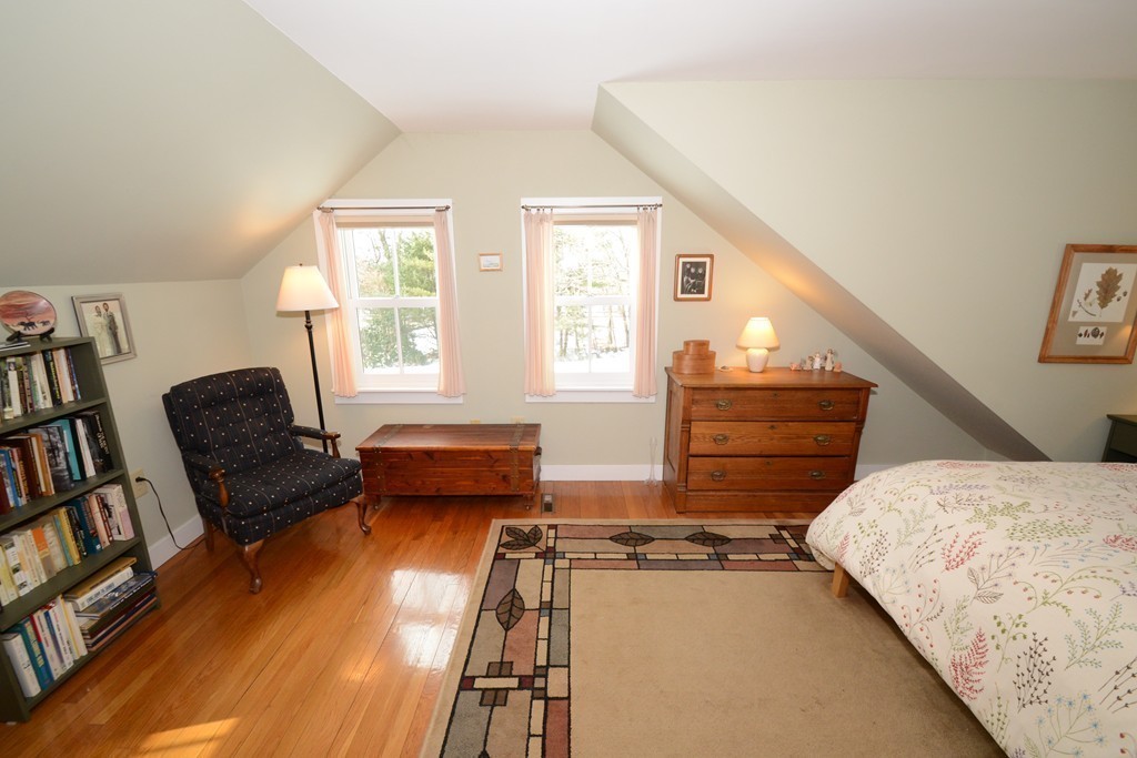 16 Juggler Meadow Road Leverett, MA 01054 - Photo 18 of 29 a bedroom with furniture and a book shelf