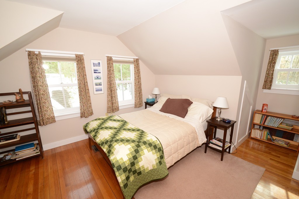 16 Juggler Meadow Road Leverett, MA 01054 - Photo 20 of 29 a bedroom with a bed a chair and next to a window