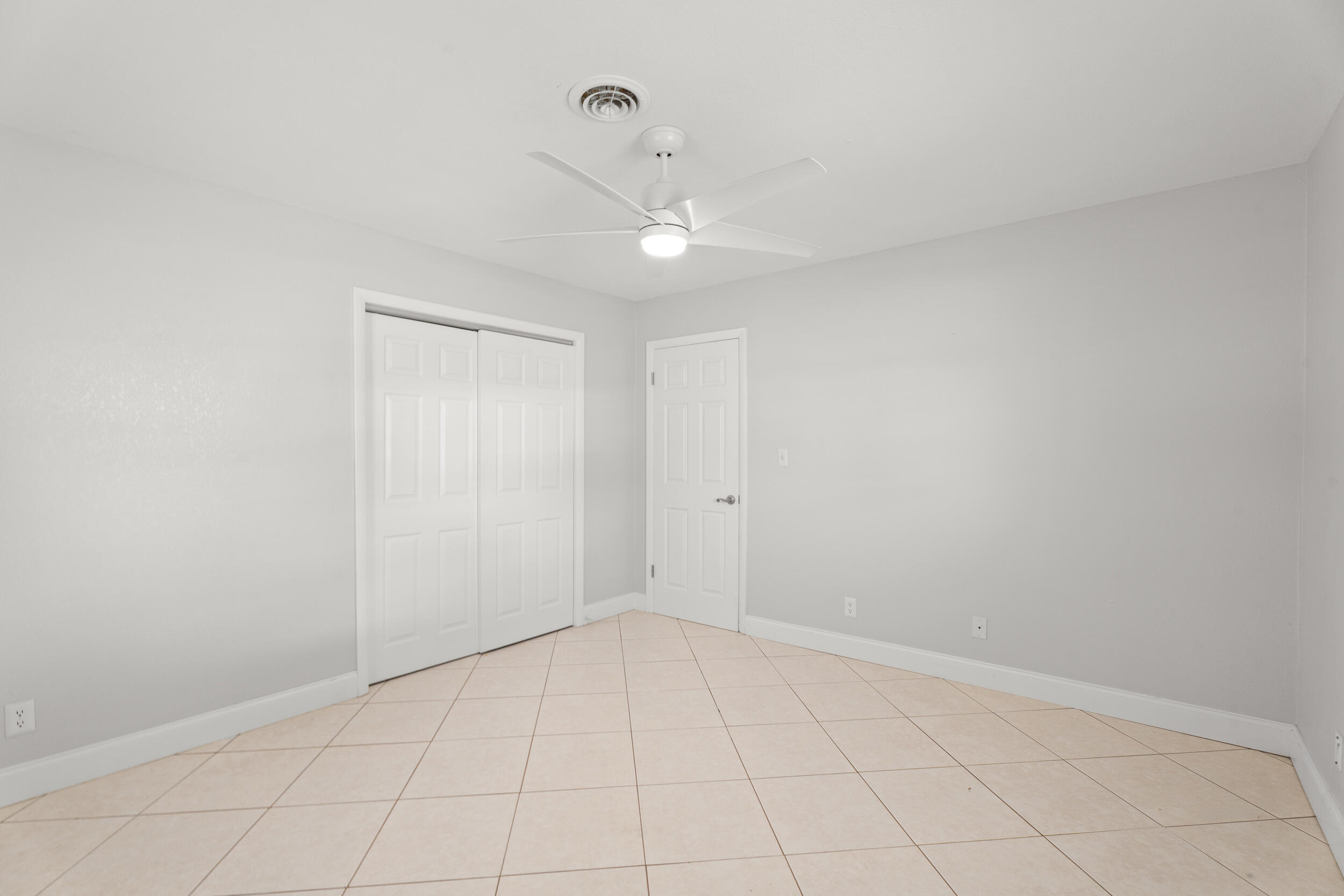 1459 Southwest Seahawk Way Palm City, FL 34990 - Photo 17 of 43 wooden floor in an empty room