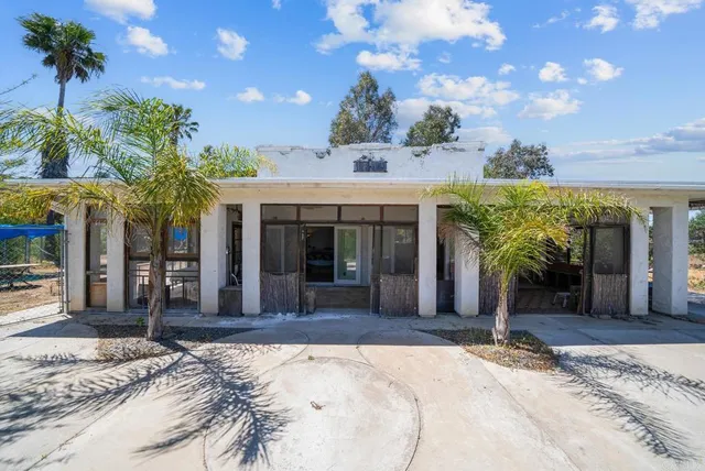 a view of a building with a yard