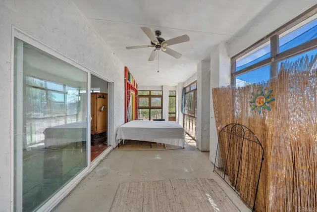 a view of a house with backyard porch and sitting area