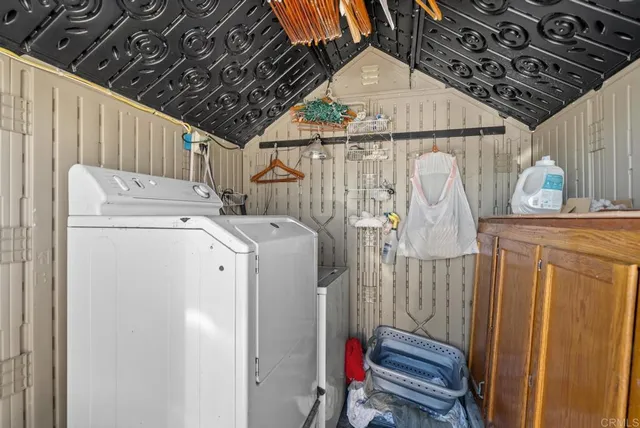a bathroom with a sink mirror and vanity