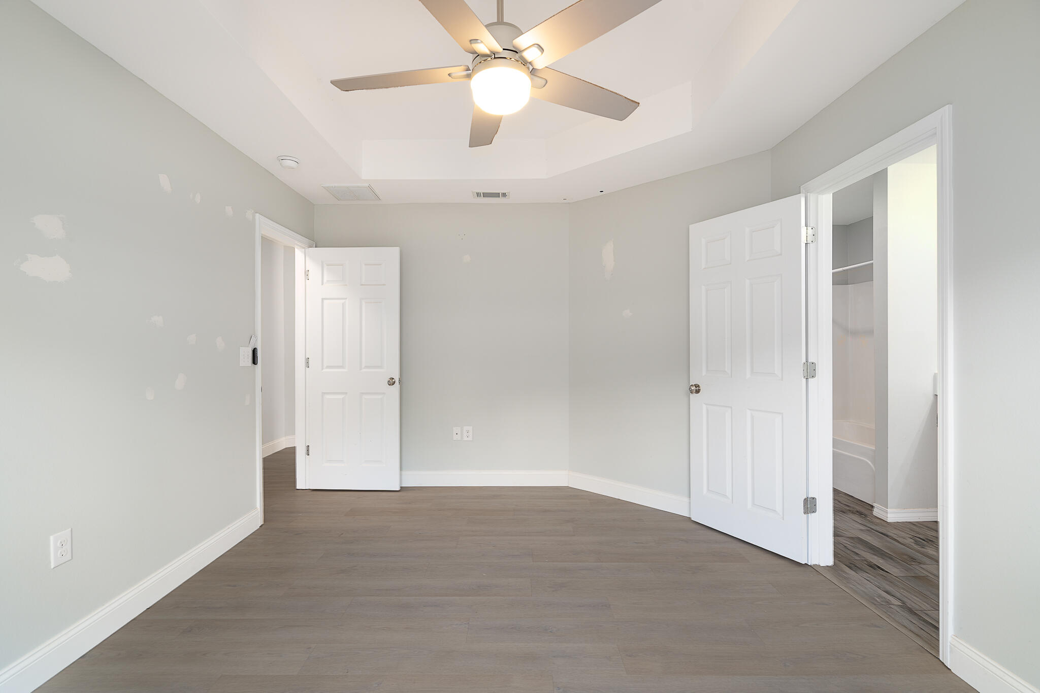 202 Mc Arthur Street Crestview, FL 32539 - Photo 16 of 39 an empty room with closet and a chandelier fan