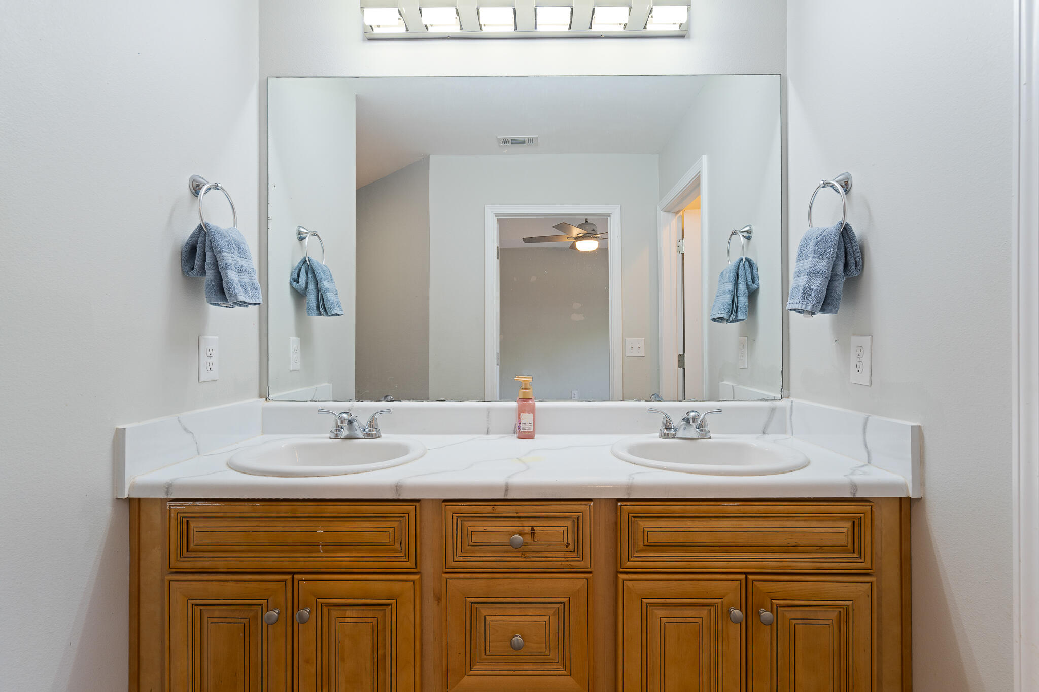 202 Mc Arthur Street Crestview, FL 32539 - Photo 19 of 39 a bathroom with a sink and a mirror