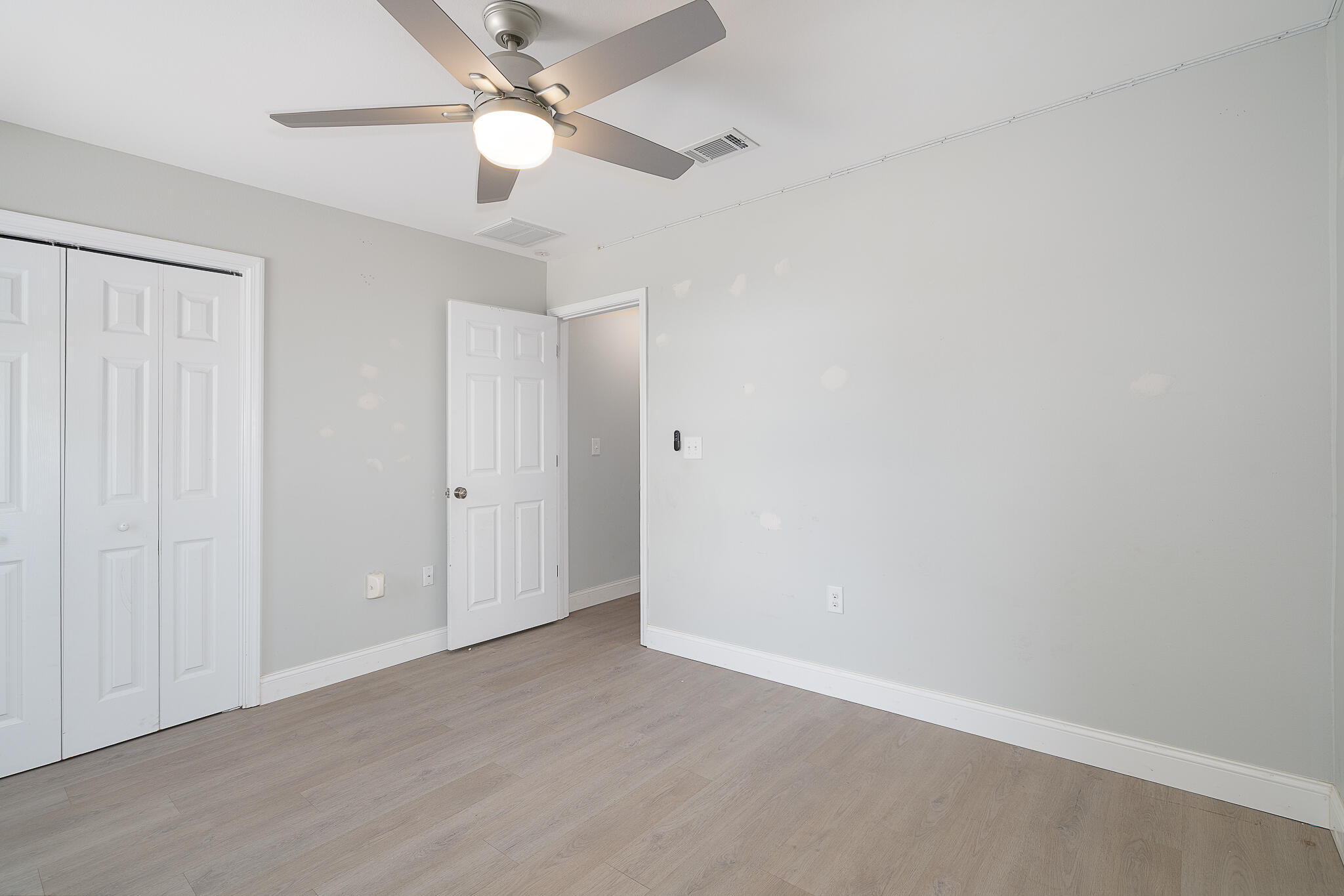 202 Mc Arthur Street Crestview, FL 32539 - Photo 30 of 39 wooden floor in an empty room