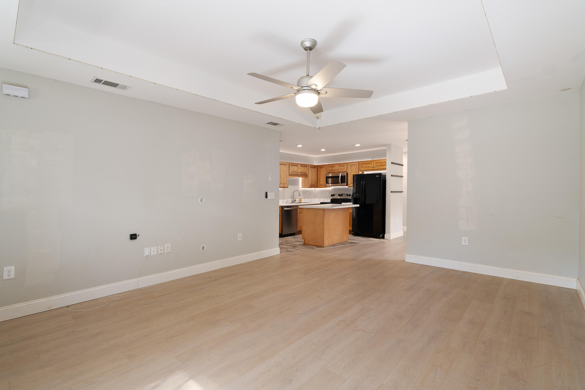 202 Mc Arthur Street Crestview, FL 32539 - Photo 6 of 39 a view of a kitchen with a sink and a refrigerator