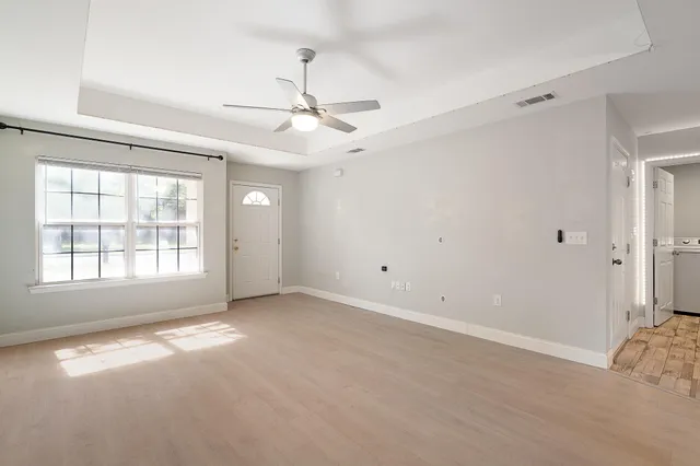 a view of an empty room with a window