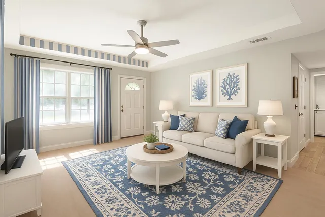 a living room with furniture and a chandelier