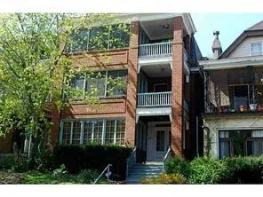 a front view of house with yard and outdoor seating