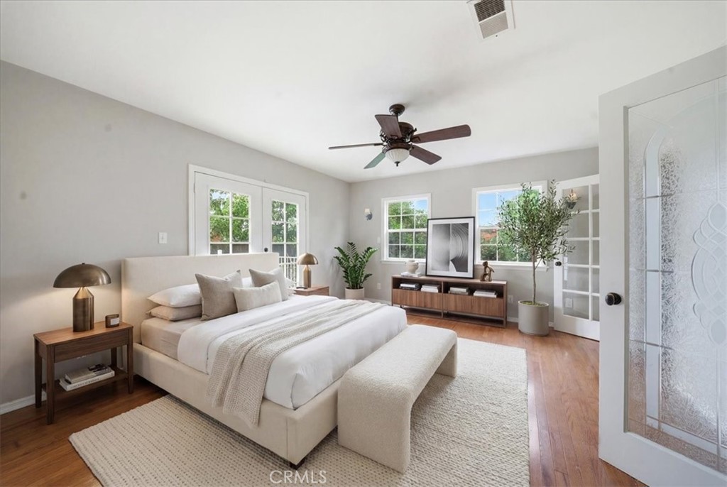 6481 Dos Rios Road Downey, CA 90240 - Photo 7 of 27 a bedroom with furniture and a large window