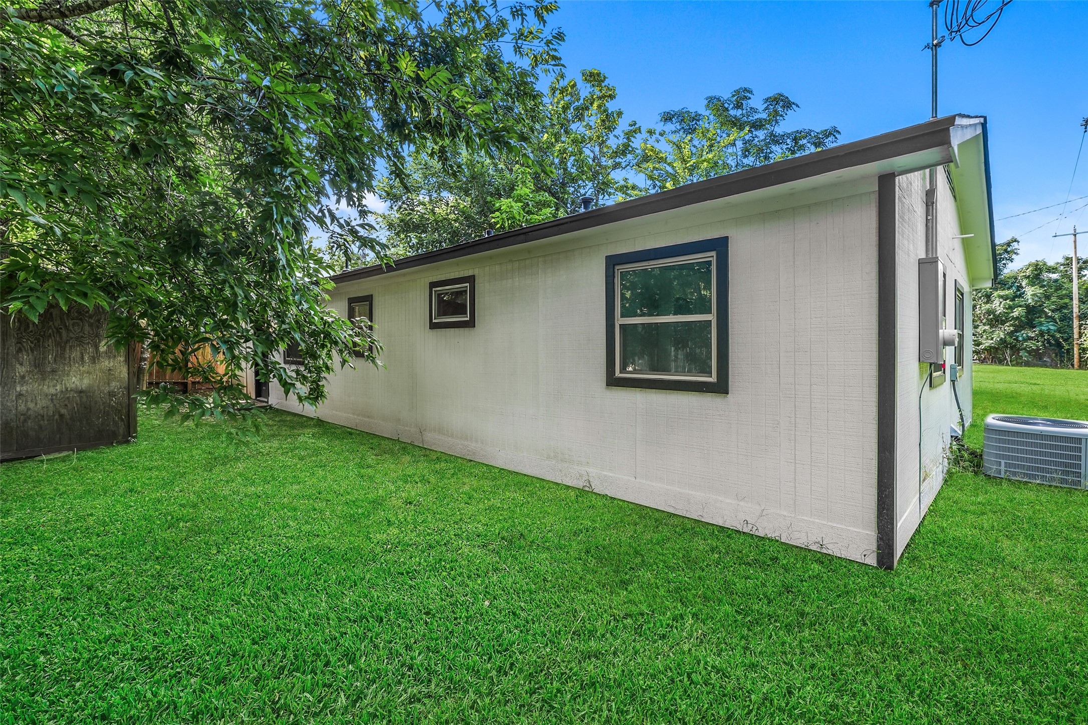 725 Lafayette Street Hempstead, TX 77445 - Photo 5 of 20 Side yard with exterior access and maintained law
