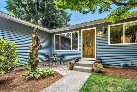 a front view of a house with garden