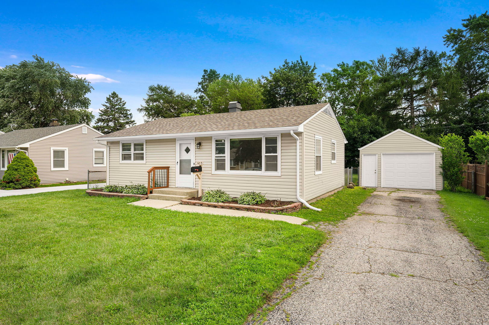415 Alma Terrace Cary, IL 60013 - Photo 1 of 23 a front view of a house with a yard