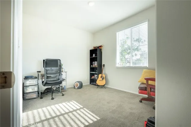 a room with a window and gym equipment