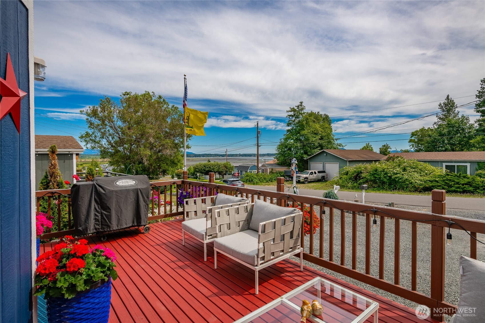 4488 Decatur Drive Ferndale, WA 98248 - Photo 25 of 38 a balcony with wooden floor and outdoor seating