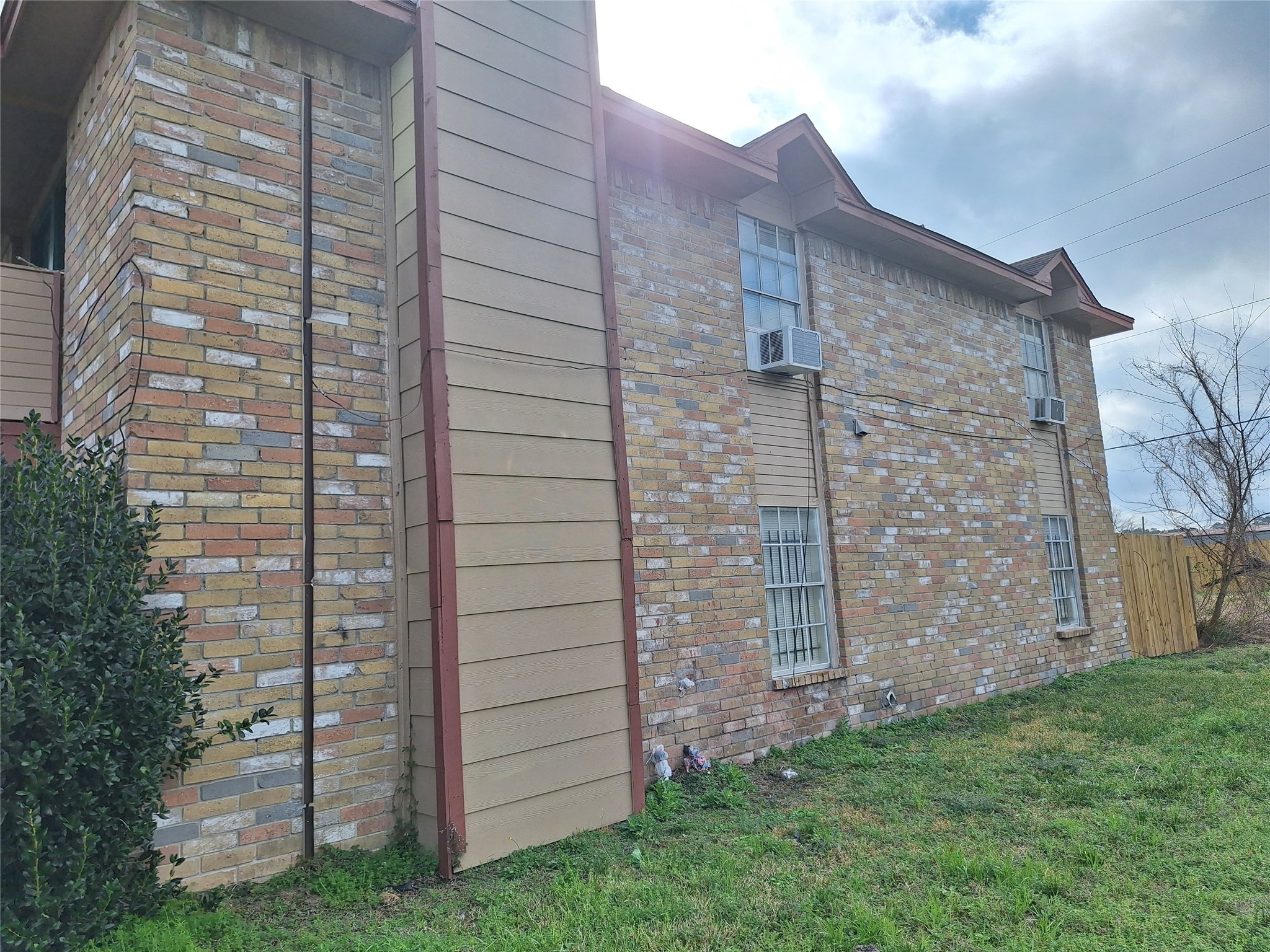 1327 Brenda Lane Humble, TX 77338 - Photo 3 of 12 a view of a door with brick walls