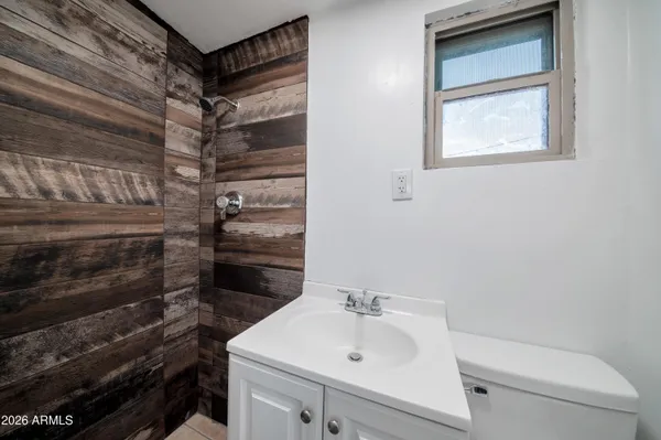 a bathroom with a sink toilet and tub
