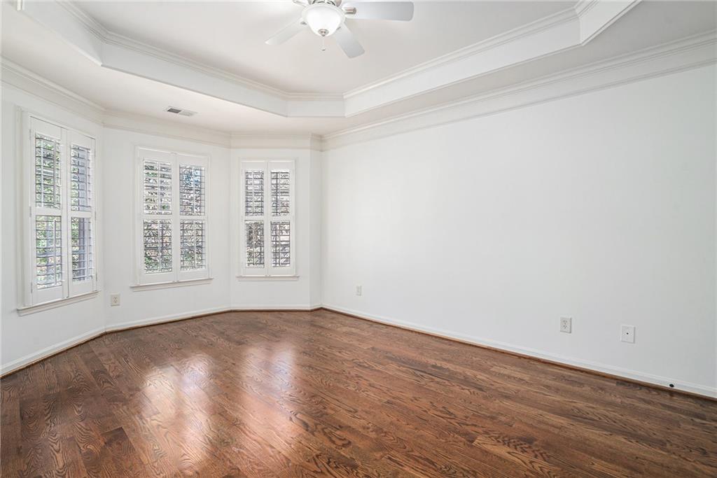3301 Chastain Ridge Drive Marietta, GA 30066 - Photo 16 of 50 a view of an empty room with wooden floor and a window