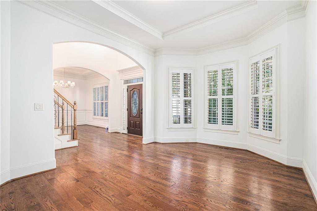 3301 Chastain Ridge Drive Marietta, GA 30066 - Photo 19 of 50 an empty room with wooden floor and windows
