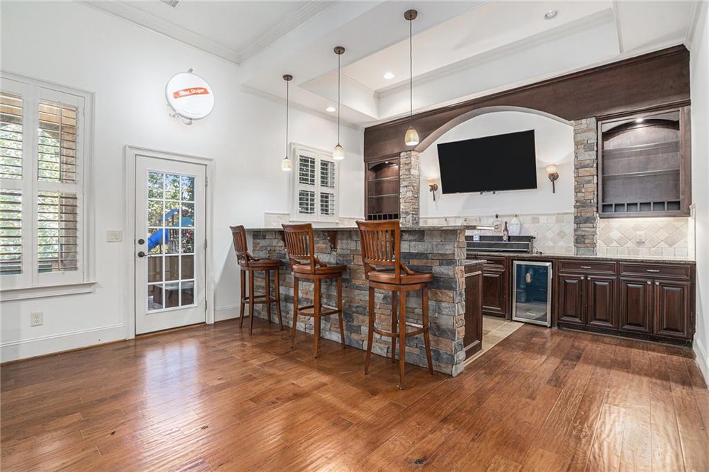 3301 Chastain Ridge Drive Marietta, GA 30066 - Photo 20 of 50 a living room with stainless steel appliances furniture and a flat screen tv