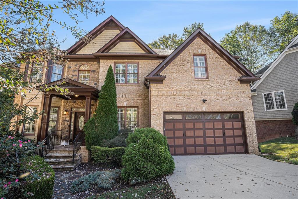 3301 Chastain Ridge Drive Marietta, GA 30066 - Photo 2 of 50 a front view of a house with a yard